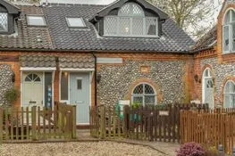 Coach House Cottage: A bijou brick and flint, semi-detached cottage offering lovely accommodation for two