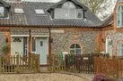 Coach House Cottage: A bijou brick and flint, semi-detached cottage offering lovely accommodation for two