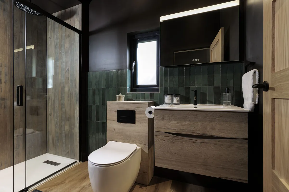 Walk-in shower and heated towel rail in the en-suite shower room