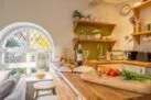 Coach House Cottage: Kitchen area with a sit at peninsular