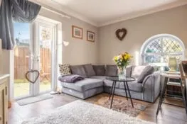 Coach House Cottage: Sitting area  with doors leading into the garden